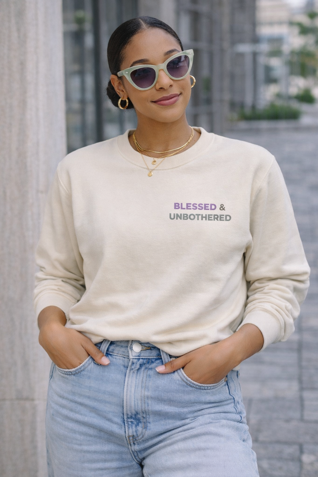 woman wearing blessed and unbothered crewneck sweatshirt casual outfit minimal embroidered purple sage
