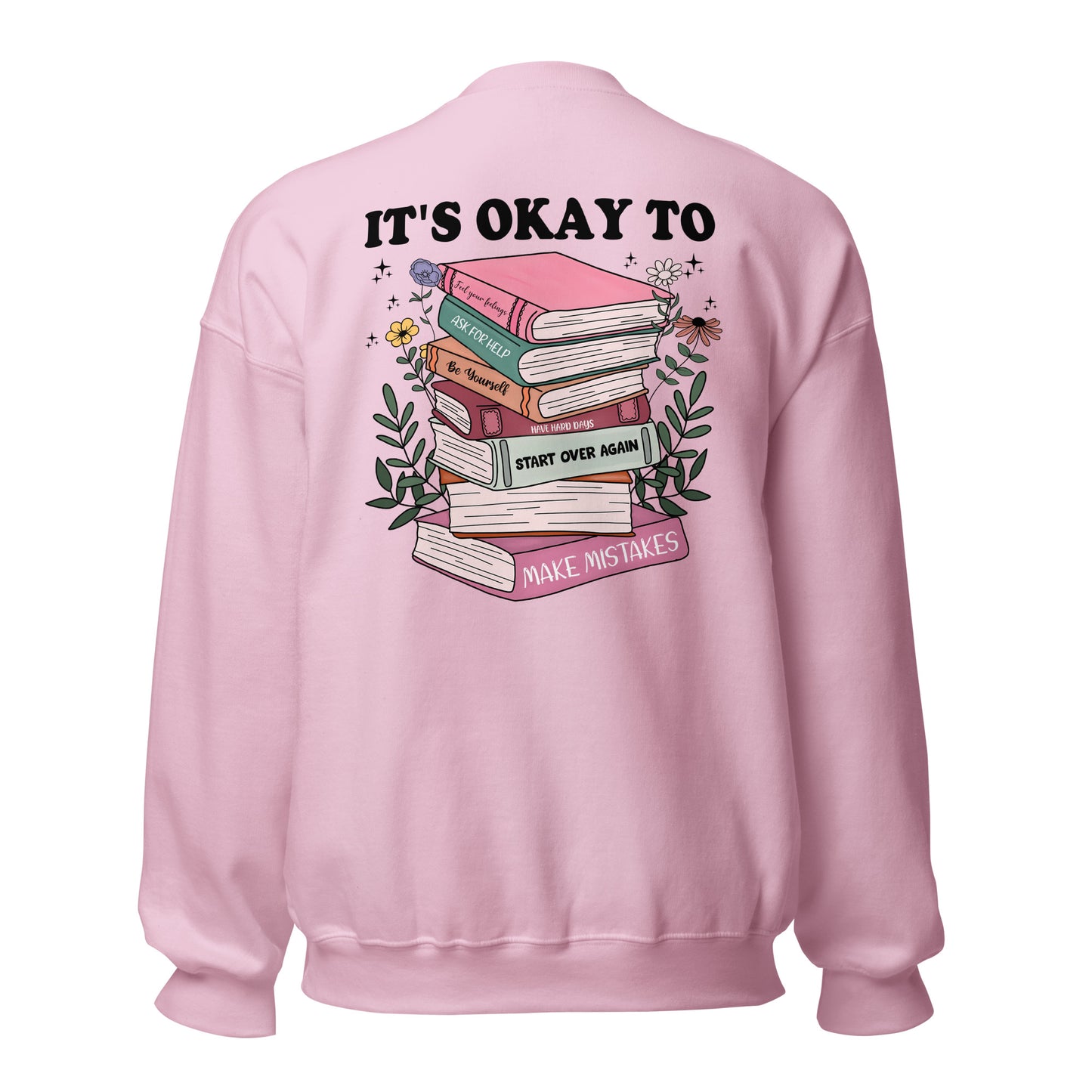 Pink sweatshirt with book stack design and "it's okay to" text on the back with a white background