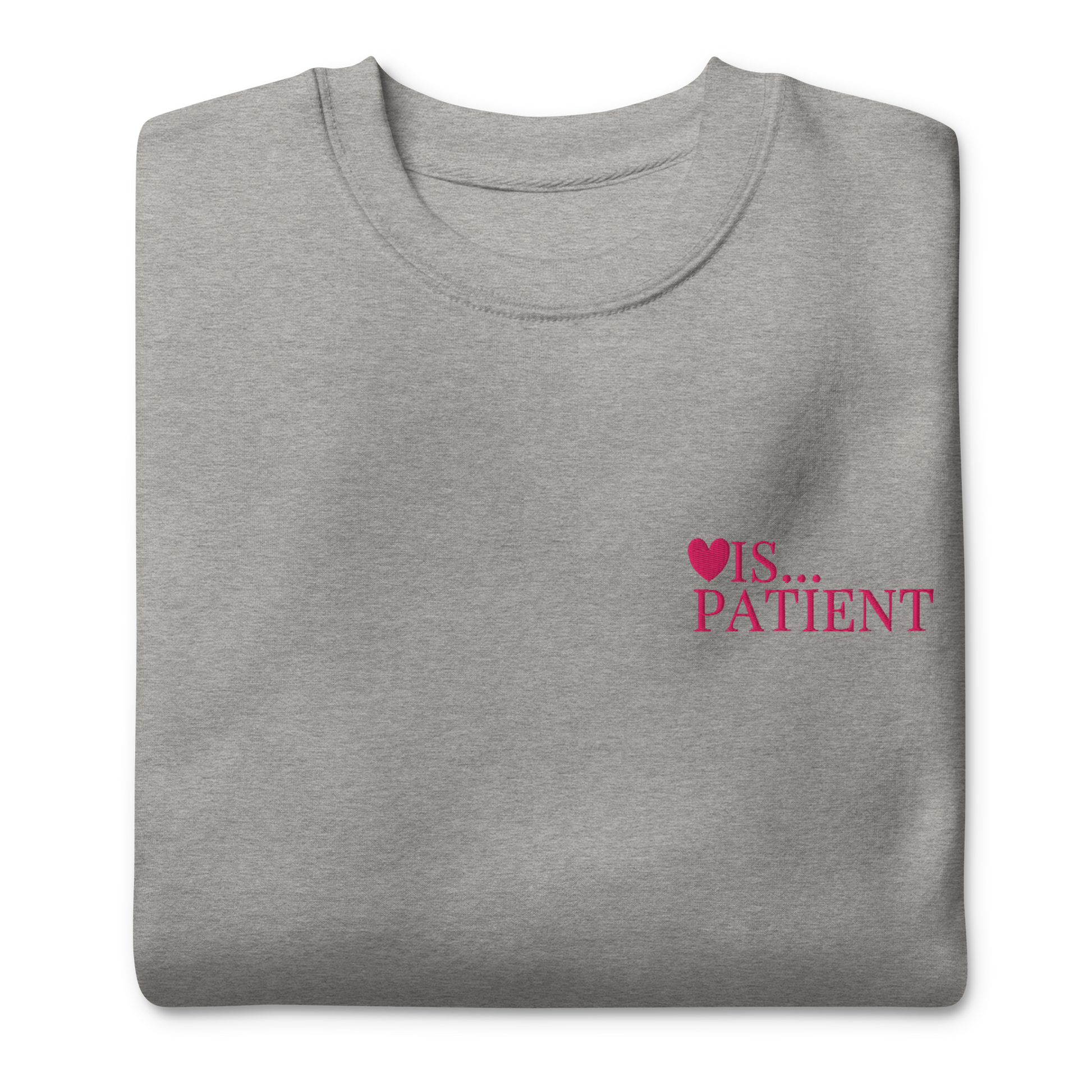 Folded gray sweatshirt with 'IS... PATIENT' text on a white background