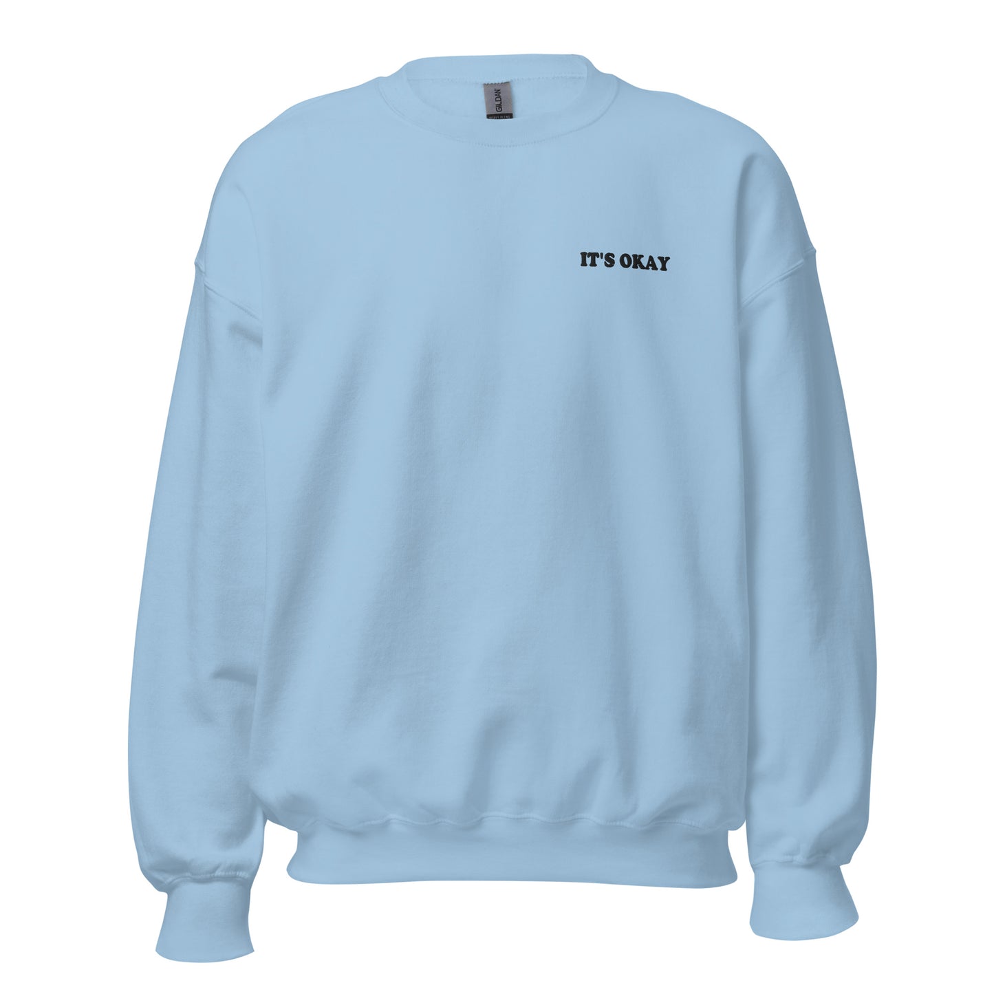 Light blue sweatshirt with 'IT'S OKAY' embroidered text on a white background